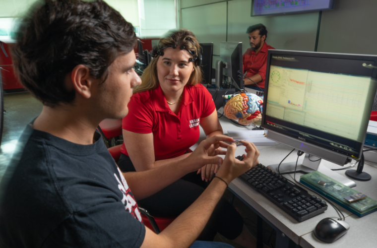 UL Lafayette electrical engineering students working on a computer brain chip