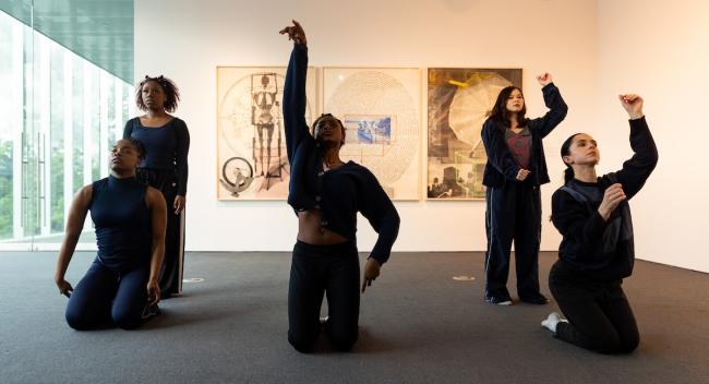 Students from the UL Lafayette Dance Program perform in front of Rauschenberg’s “Autobiography” at the Hilliard Art Museum.